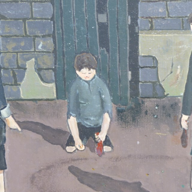 Three boys playing 'bools' (marbles)